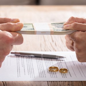 Couple fighting over Money and Divorce. CA's best divorce lawyer, Peter M. Walzer, explains how to solve financial issues in a relationship or marriage.