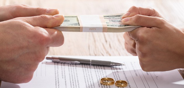 Couple fighting over Money and Divorce. CA's best divorce lawyer, Peter M. Walzer, explains how to solve financial issues in a relationship or marriage.
