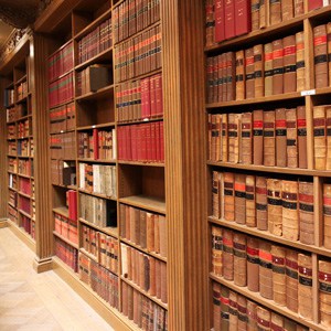 A book shelf with several law books