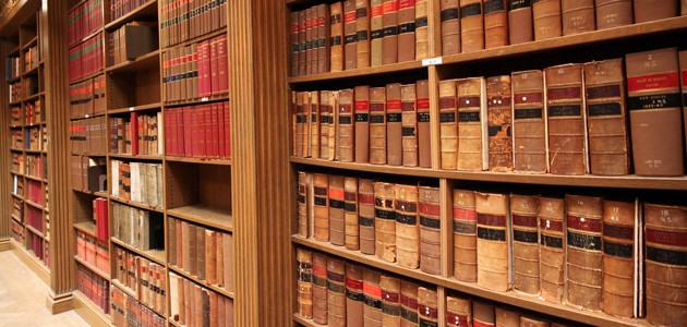 A book shelf with several law books