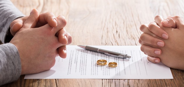 A couple going over divorce papers indicating Complex Family Law Issues