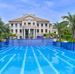 A mansion with a huge pool