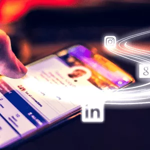 hand interacting on a social media page on a mobile device with social media logos above it