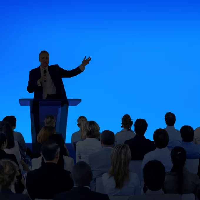 Person speaking at a seminar
