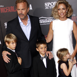 Kevin Costner and Christine Baumgartner at a movie premiere in 2015 with their kids