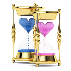 Pink and blue golden hourglasses against a white background