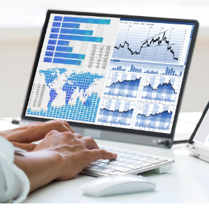 Financial analysis and business valuation data reviewed during a business owner divorce case. A person's hands on a computer who is looking at analytics on a computer screen.
